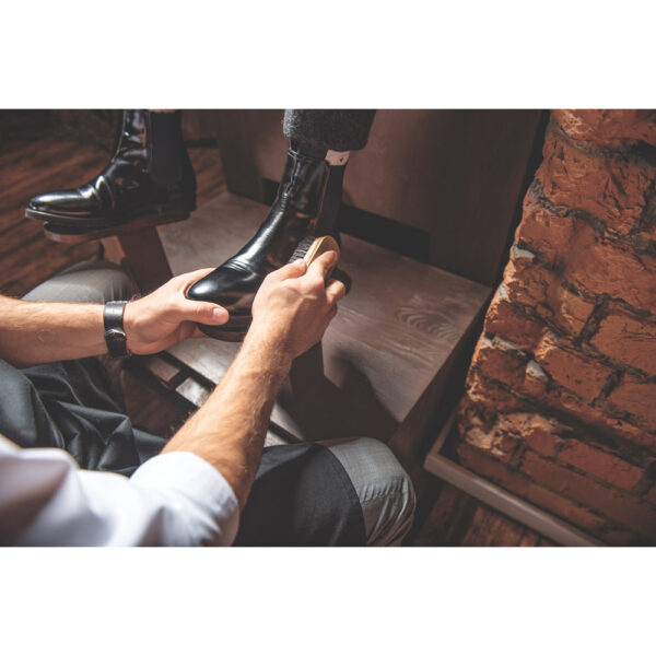 Young,Businessman,Polishing,Footwear,Of,The,Man